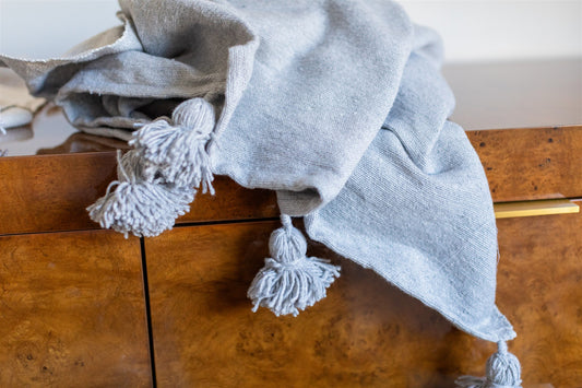 Gray berber throw on a bed
